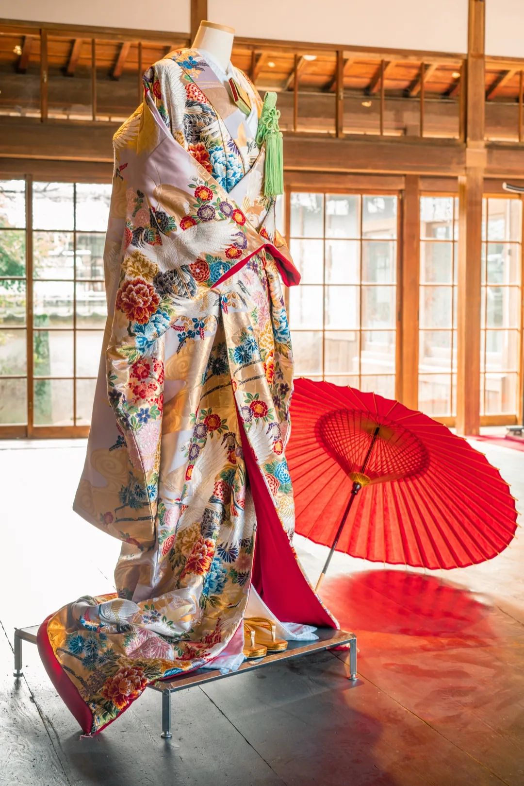 Kimono with red umbrella at a traditional hotel